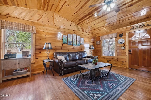 living room featuring a healthy amount of sunlight, wooden ceiling, vaulted ceiling, and hardwood / wood-style flooring