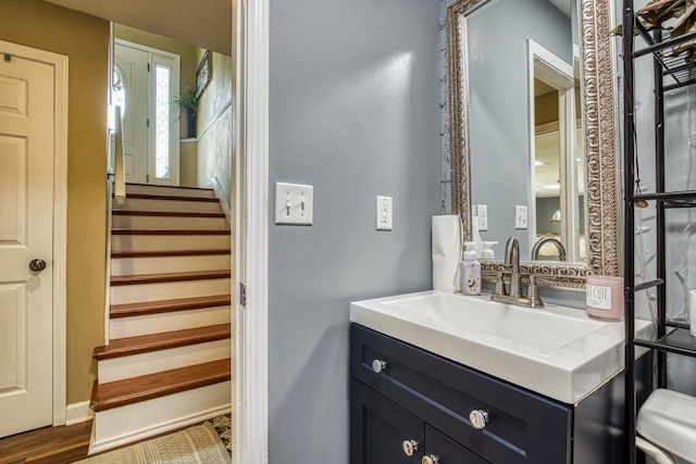 bathroom with vanity and wood-type flooring