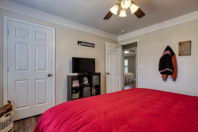 bedroom with dark wood-type flooring and ceiling fan