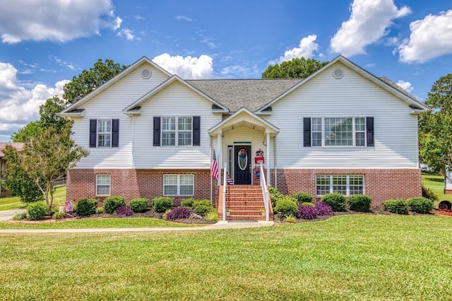 bi-level home with a front lawn