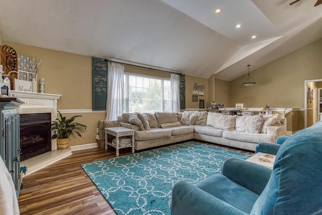 living room with lofted ceiling and dark hardwood / wood-style floors