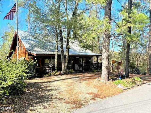 view of front of property with metal roof and a porch