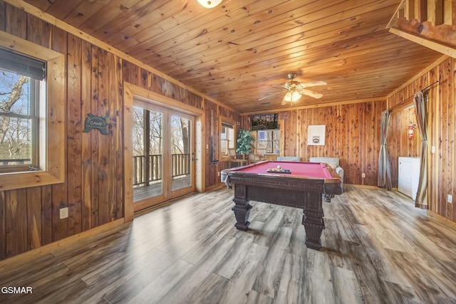 game room with a wealth of natural light, wooden ceiling, and wood finished floors