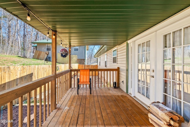 wooden deck featuring a fenced backyard