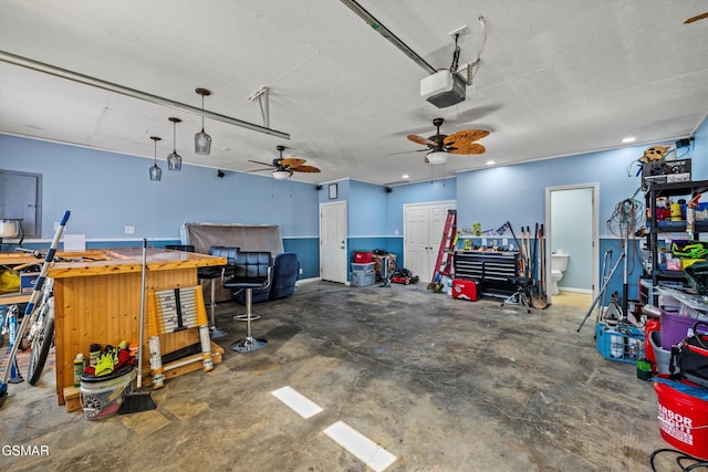 garage featuring recessed lighting, a garage door opener, and ceiling fan