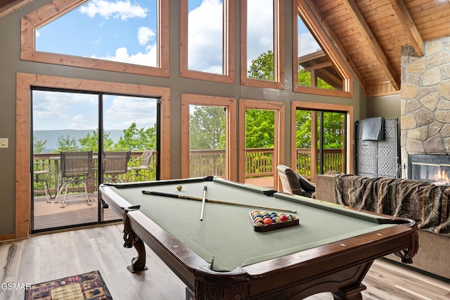 game room featuring wooden ceiling with exposed beams, pool table, high vaulted ceiling, light wood-style flooring, and healthy amount of natural light
