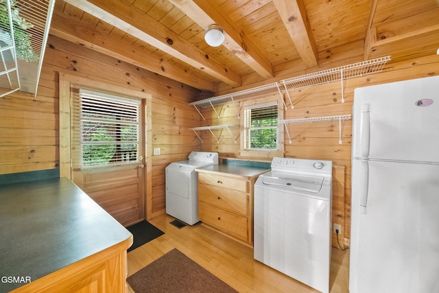 915 Statham Way, Gatlinburg, TN 37738 - clothes washing area featuring wooden walls, washing machine and dryer, light wood-style flooring, and wooden ceiling