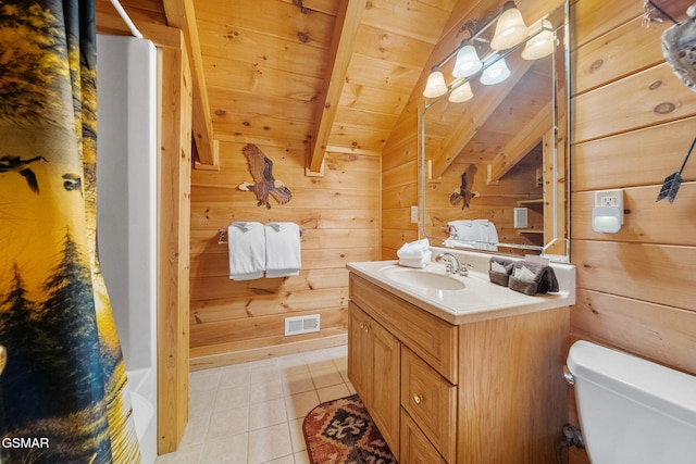 915 Statham Way, Gatlinburg, TN 37738 - full bathroom featuring a shower with shower curtain, tile patterned flooring, toilet, wood walls, and vanity