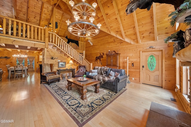 915 Statham Way, Gatlinburg, TN 37738 - living room featuring a chandelier, wooden walls, stairway, hardwood / wood-style floors, and wooden ceiling
