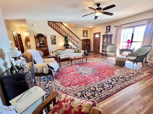 living room with hardwood / wood-style flooring and ceiling fan