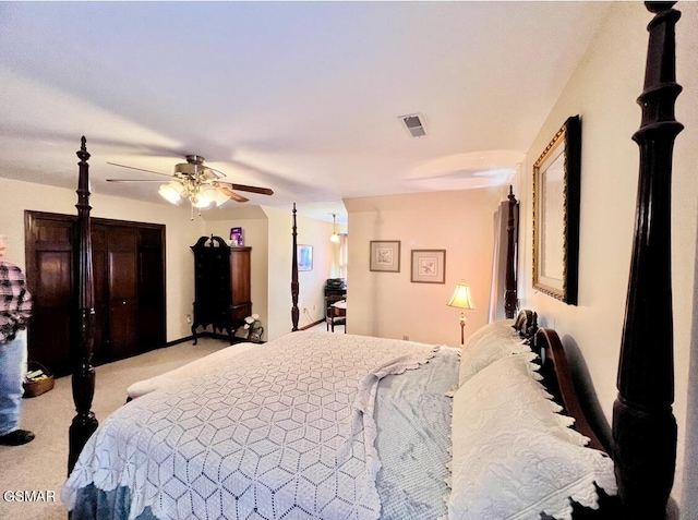 carpeted bedroom featuring ceiling fan