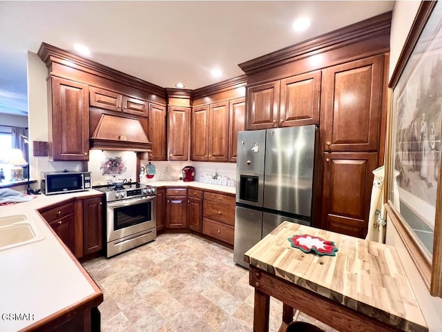 kitchen featuring premium range hood, sink, and stainless steel appliances