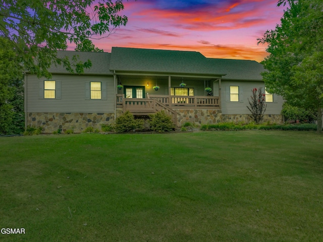1668 Deerwood Rd, Newport, TN 37821 - view of front facade with a front yard, covered porch, roof with shingles, and stone siding