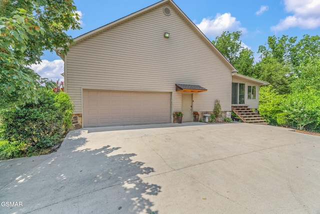 1668 Deerwood Rd, Newport, TN 37821 - view of side of home featuring concrete driveway, stone siding, and stairs