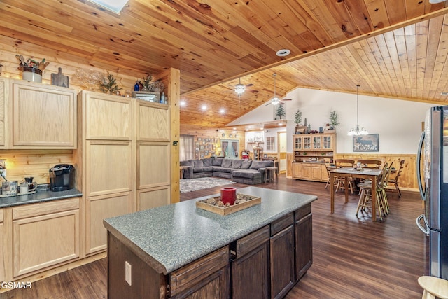 1668 Deerwood Rd, Newport, TN 37821 - kitchen with dark countertops, a wainscoted wall, freestanding refrigerator, vaulted ceiling, and dark wood-style floors