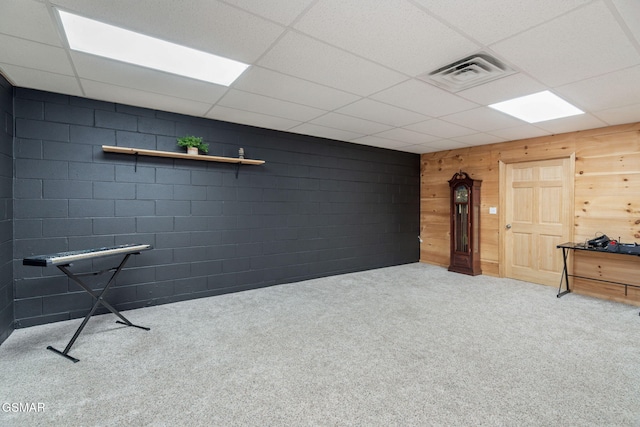 1668 Deerwood Rd, Newport, TN 37821 - basement with carpet floors, wood walls, and a drop ceiling