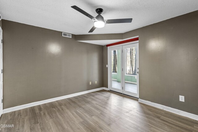 221 Woodland Rd Unit 315, Gatlinburg, TN 37738 - empty room with wood finished floors, a textured ceiling, baseboards, visible vents, and ceiling fan