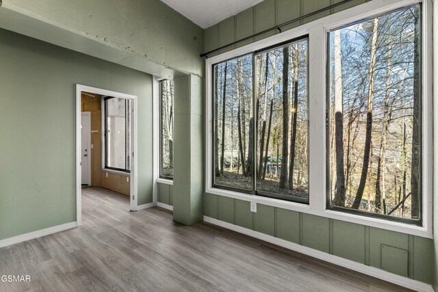 221 Woodland Rd Unit 315, Gatlinburg, TN 37738 - spare room with baseboards, wood finished floors, and a healthy amount of sunlight