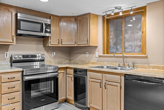221 Woodland Rd Unit 315, Gatlinburg, TN 37738 - kitchen featuring light brown cabinets, light countertops, a sink, and appliances with stainless steel finishes
