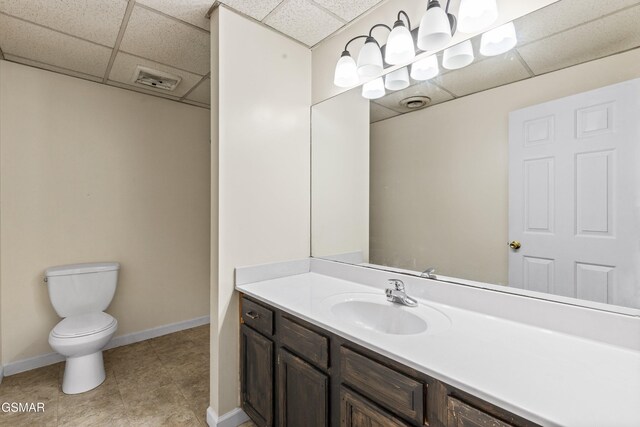 221 Woodland Rd Unit 315, Gatlinburg, TN 37738 - bathroom featuring vanity, toilet, baseboards, a drop ceiling, and visible vents