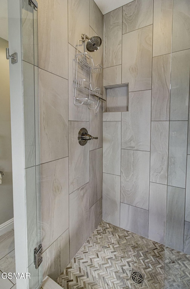full bath with a shower stall