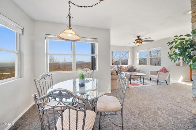 dining room with carpet floors and ceiling fan