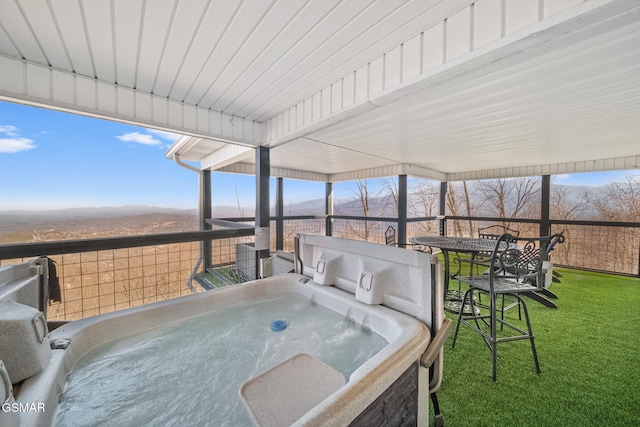 view of patio with a hot tub