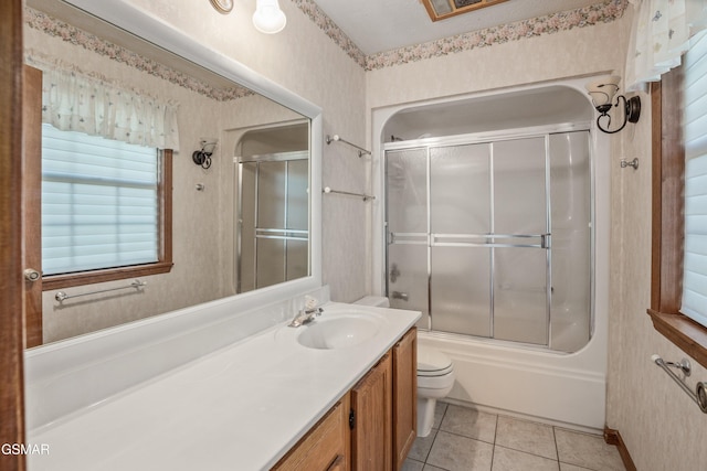 unfurnished bedroom featuring a closet, carpet flooring, baseboards, and a ceiling fan