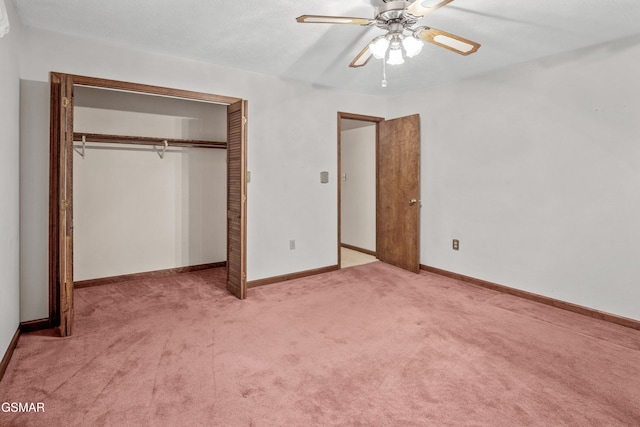 unfurnished bedroom featuring a closet, carpet, ceiling fan, and baseboards