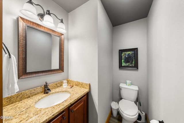 bathroom with toilet and vanity