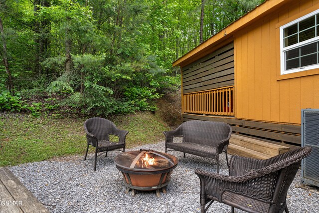 3040 Grassy Branch Loop, Sevierville, TN 37876 - view of patio / terrace with an outdoor fire pit