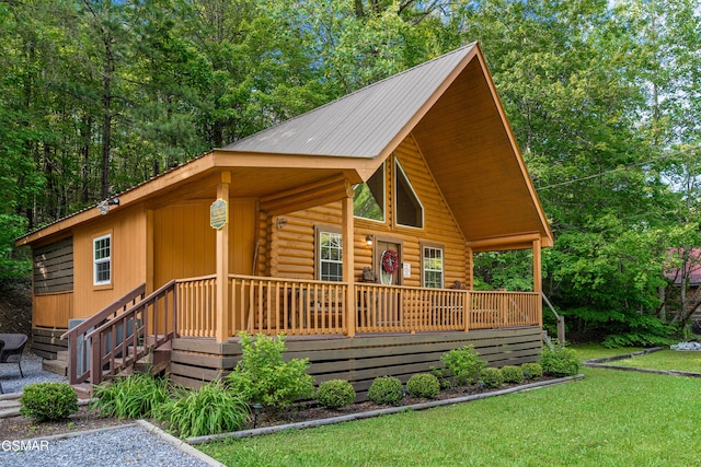 3040 Grassy Branch Loop, Sevierville, TN 37876 - view of front of property with log exterior, covered porch, a front yard, and metal roof