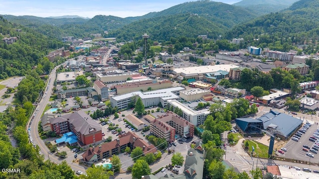 685 River Rd Unit 314, Gatlinburg, TN 37738 - aerial overview of property's location with a mountainous background and a forest