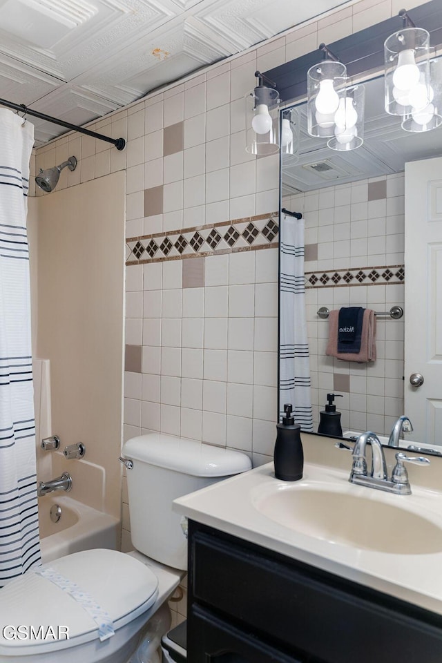 685 River Rd Unit 314, Gatlinburg, TN 37738 - bathroom with tile walls, vanity, shower / bathtub combination with curtain, and toilet