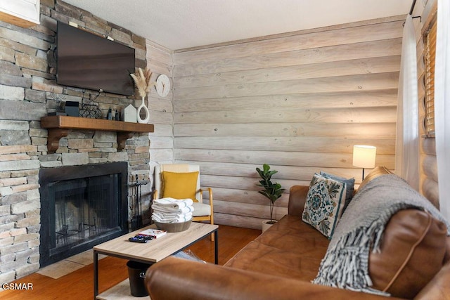 685 River Rd Unit 314, Gatlinburg, TN 37738 - living room featuring wood finished floors and a stone fireplace