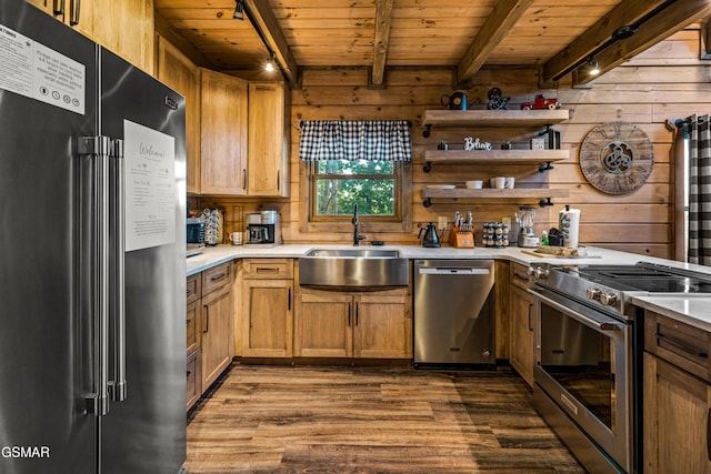 kitchen featuring high end appliances, beam ceiling, sink, and wooden ceiling