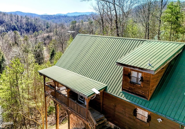 bird's eye view featuring a mountain view and a view of trees