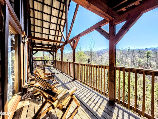 wooden deck featuring a wooded view