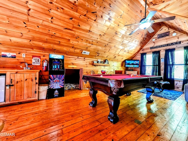 rec room featuring lofted ceiling, wooden walls, wooden ceiling, and hardwood / wood-style flooring