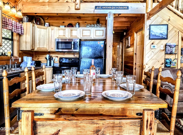 dining room featuring wooden walls