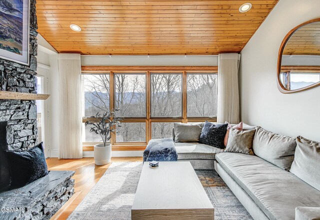 1130 Ski View Dr Unit 315, Gatlinburg, TN 37738 - living room featuring wood ceiling, vaulted ceiling, a stone fireplace, wood finished floors, and recessed lighting