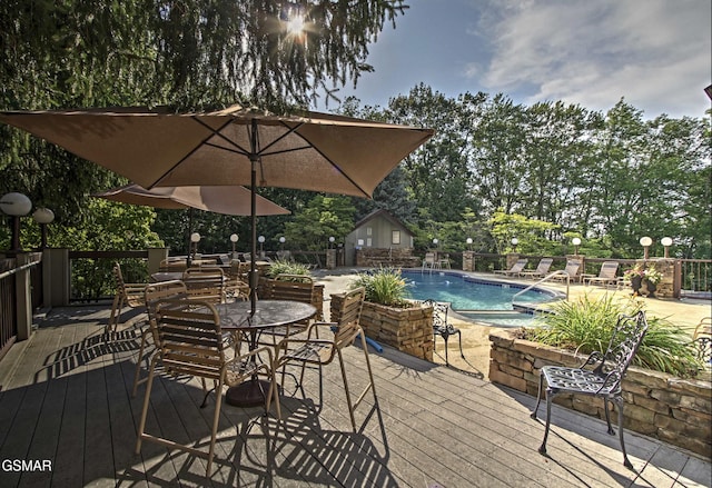 1130 Ski View Dr Unit 315, Gatlinburg, TN 37738 - deck with a community pool, outdoor dining area, and view of wooded area