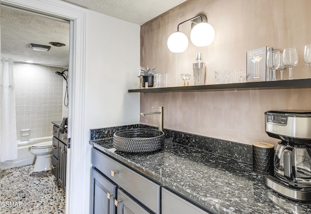 1130 Ski View Dr Unit 315, Gatlinburg, TN 37738 - full bathroom with a textured ceiling, vanity, and shower / tub combo with curtain