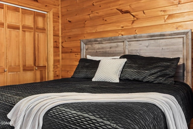 bedroom with wooden walls