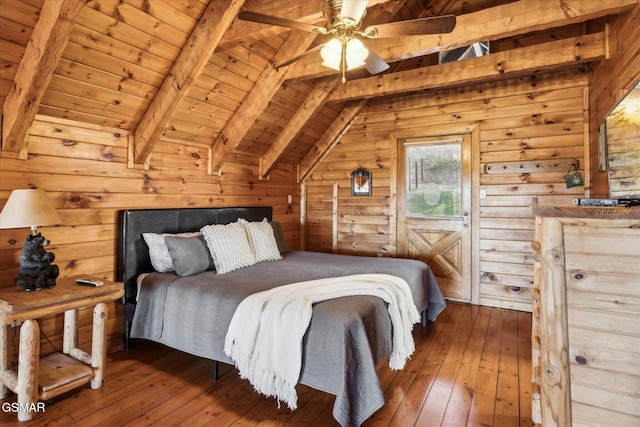 bedroom featuring lofted ceiling with beams, wood walls, wooden ceiling, and hardwood / wood-style floors