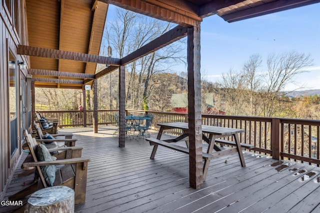 deck featuring outdoor dining area