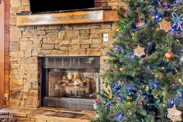 exterior details with stone siding and an outdoor stone fireplace