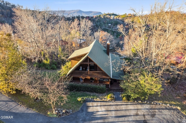 bird's eye view featuring a forest view and a mountain view