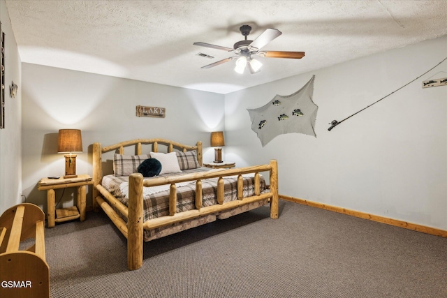 bedroom with a textured ceiling, a ceiling fan, visible vents, baseboards, and carpet