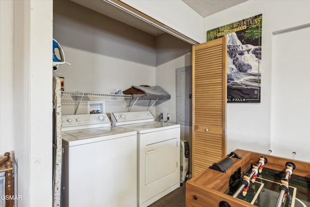 clothes washing area with laundry area and washing machine and clothes dryer